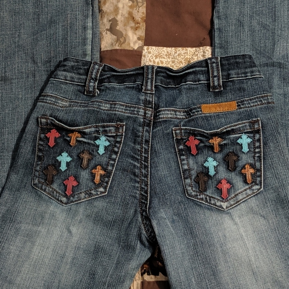 Cowgirl Tuff Boot cut jeans with gorgeous designs